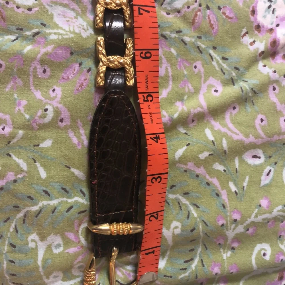Gold and brown belt 35 inches to first hole. Size M